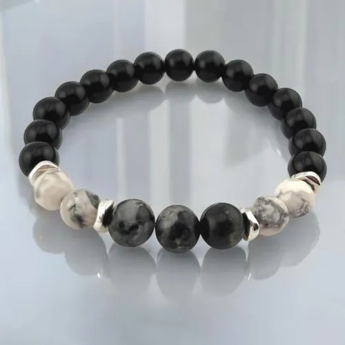 Assorted obsidian types showing color variations against light