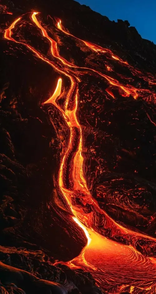 Close-up of hands holding volcanic glass in soft focus