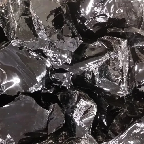 Close-up of polished black obsidian jewelry on wrist