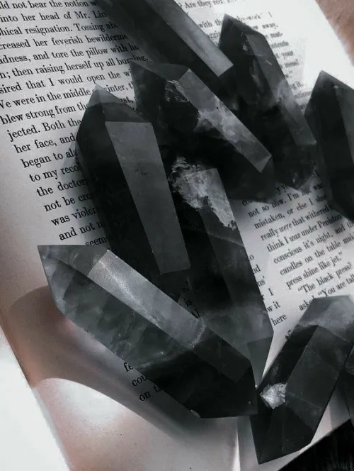 Magnified obsidian surface showing natural bubbles and inclusions