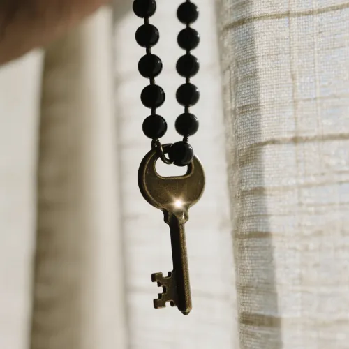 Natural red obsidian formation showing layers within volcanic rock