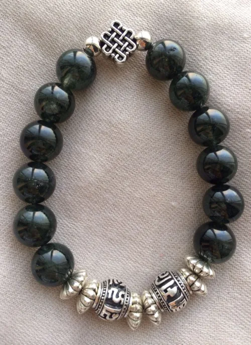 Obsidian held safely on textured surface in bathroom lighting