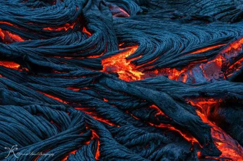 Obsidian jewelry pieces on a fabric background