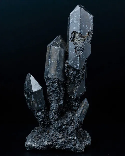 Person holding snowflake obsidian against sunlight showcasing internal patterns