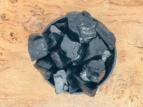 Wrist showing obsidian bracelets with office attire